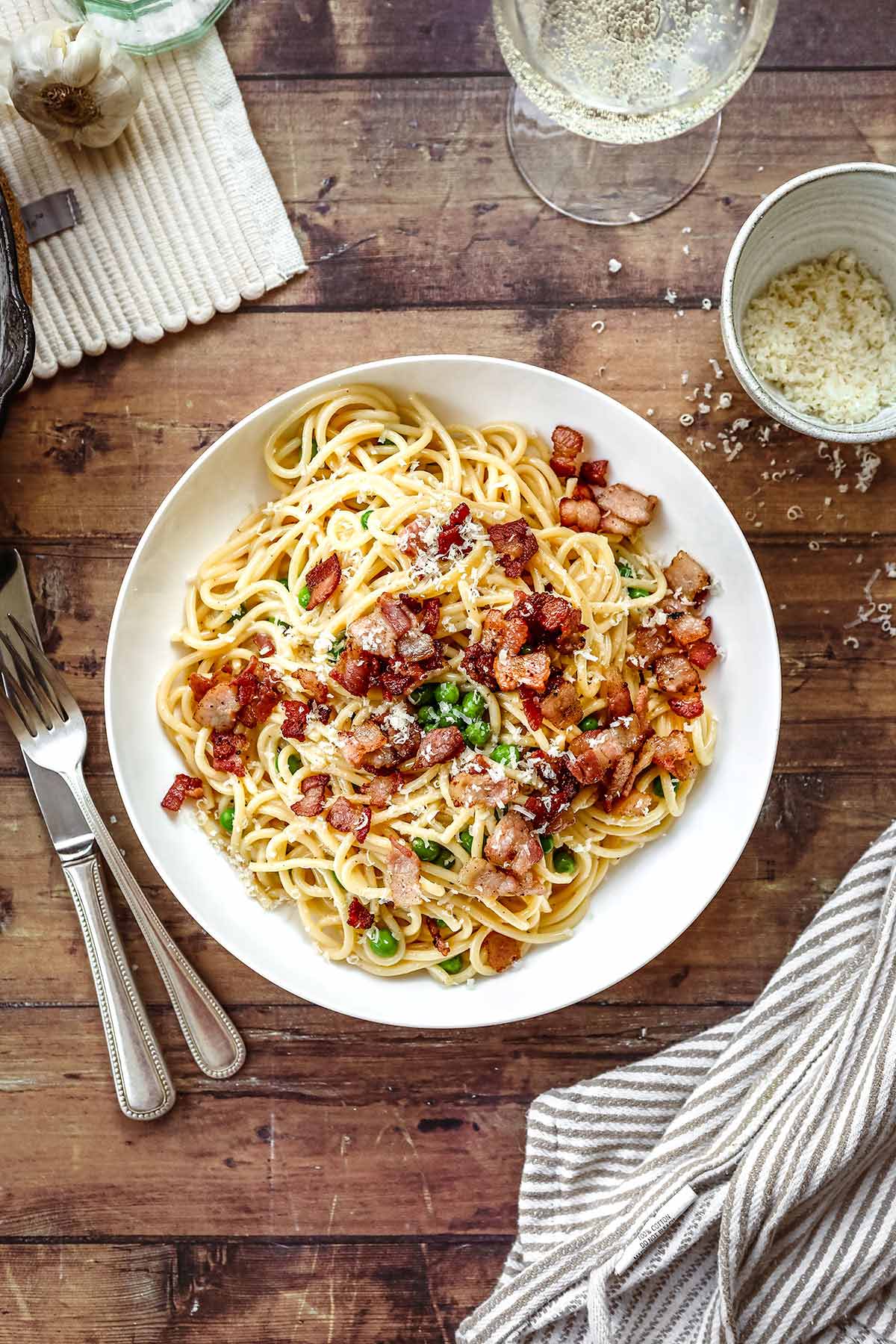 Bacon Carbonara Pasta with peas on a plate