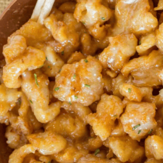 chicken in a bowl covered in sauce