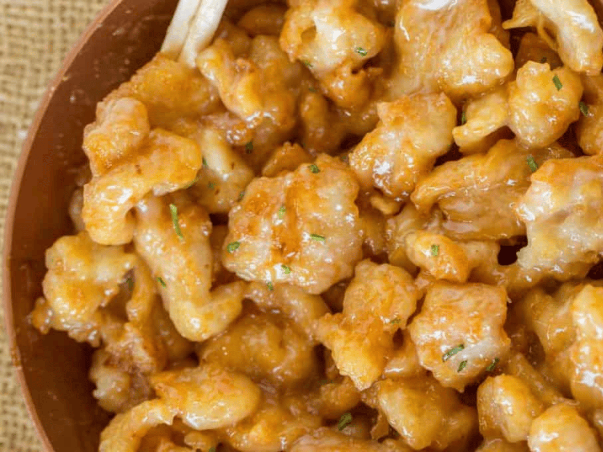 chicken in a bowl covered in sauce
