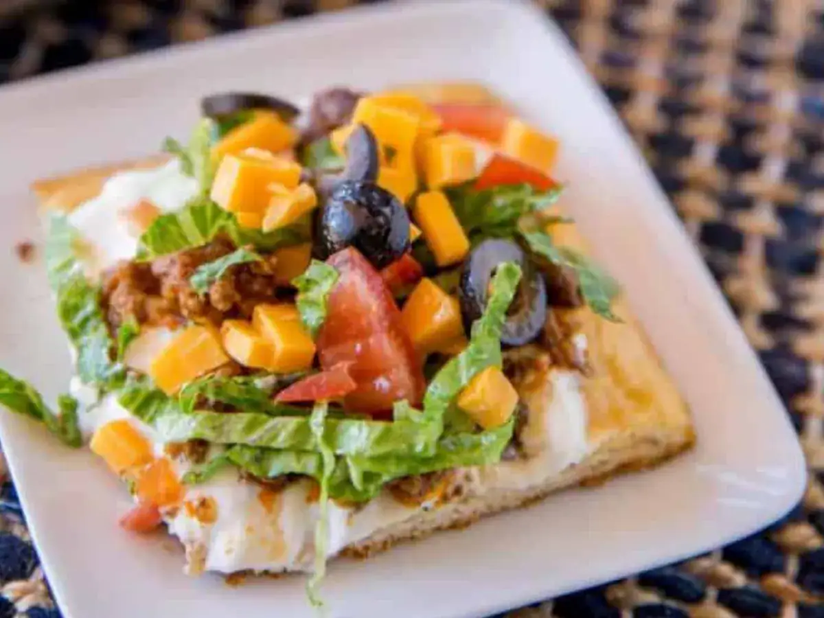pizza served on white plate