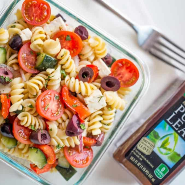 pyrex of Pasta Salad with a homemade vinaigrette with fork and bottle of tea