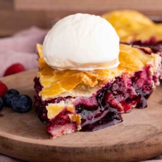 Mixed Berry Pie slice with ice cream side view