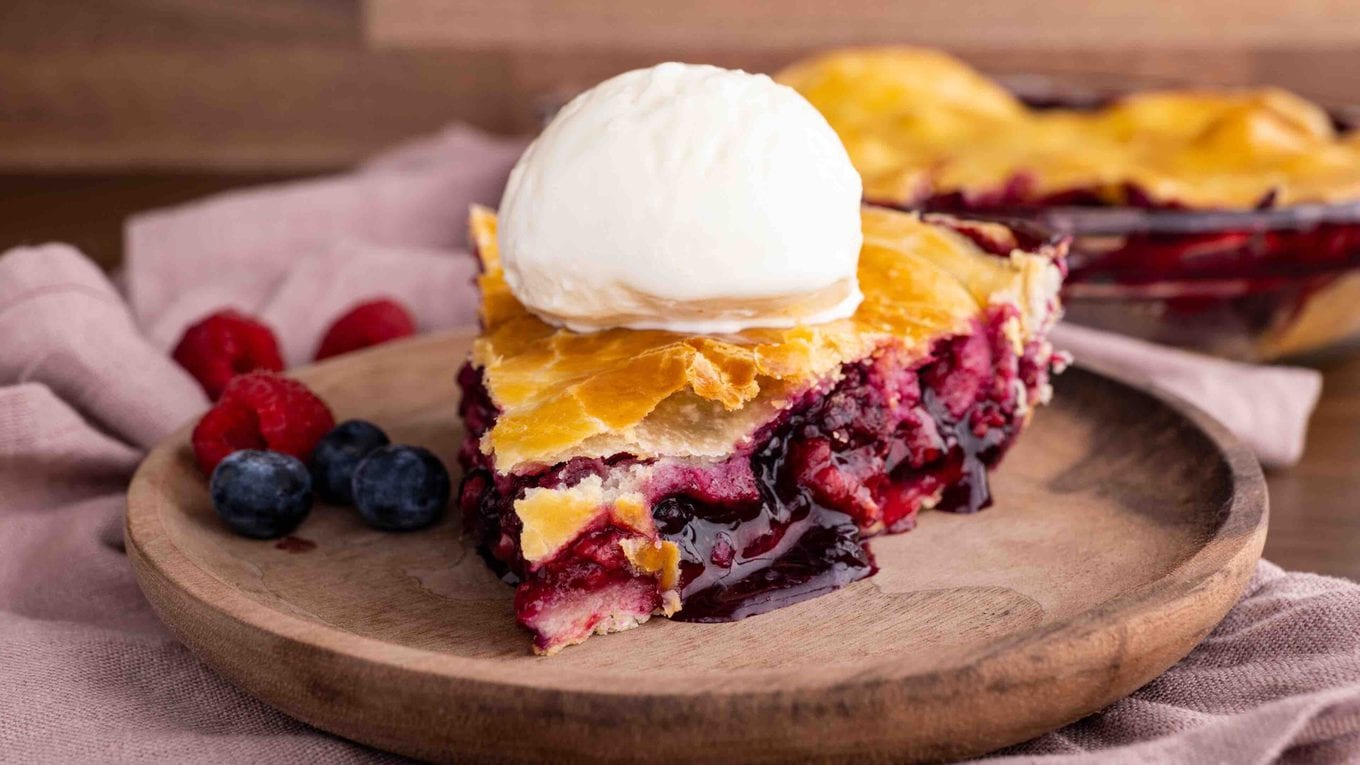 Mixed Berry Pie slice with ice cream side view