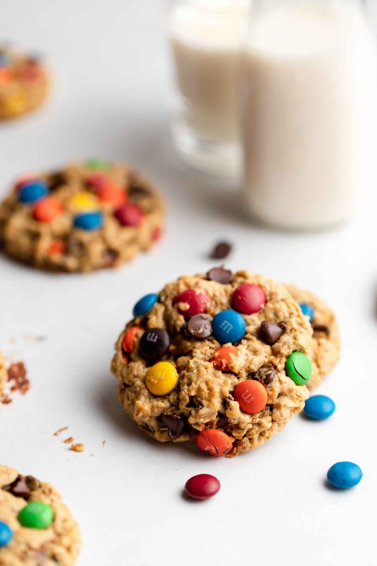 Monster Cookies on table with glass of milk