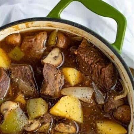 Vegetables and beef cooked in a pot, ready to serve