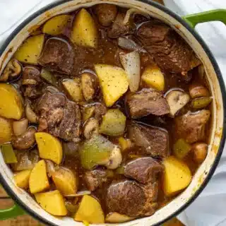stew in a pot with meat and potatoes