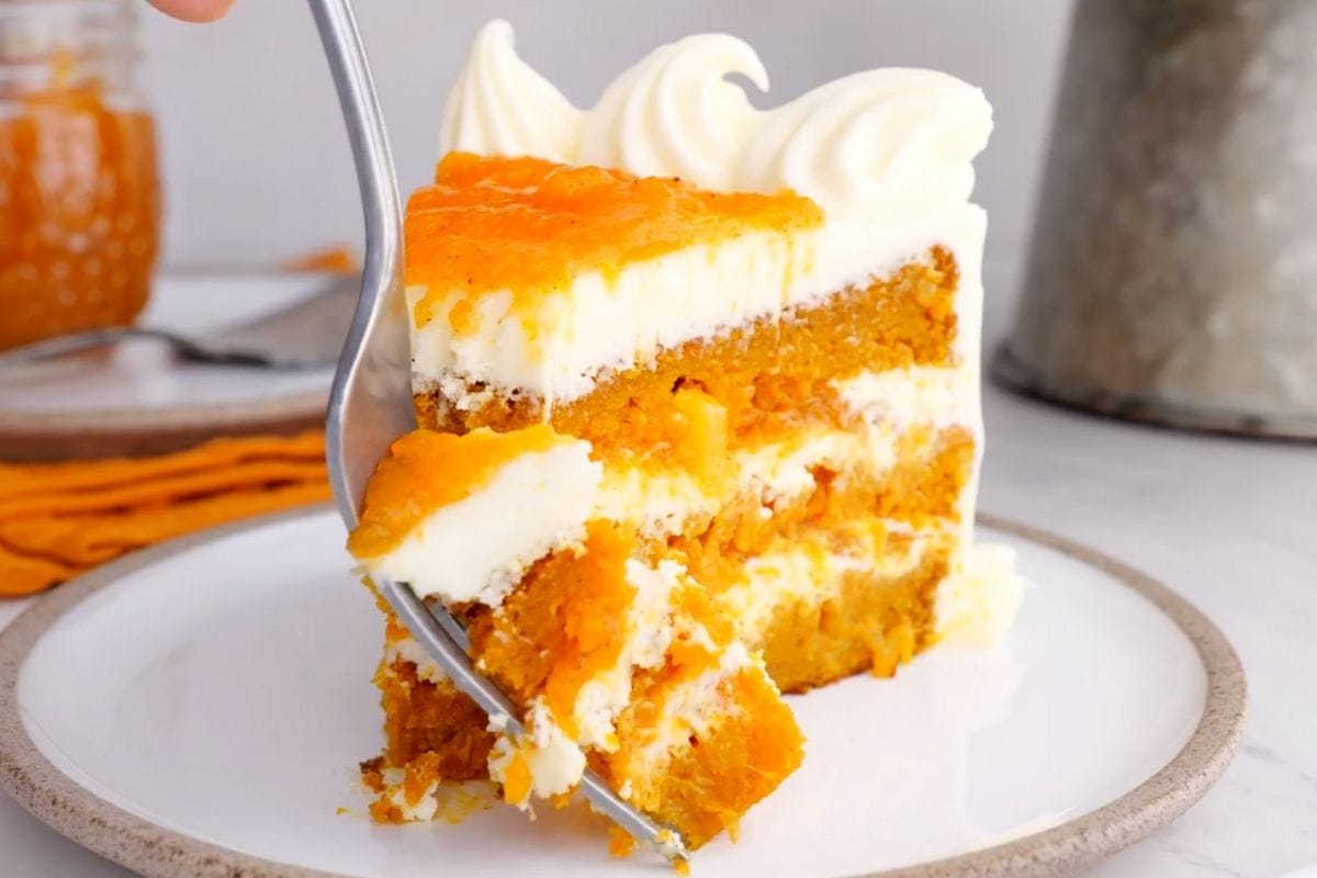 Ultimate Carrot Cake slice on plate with fork