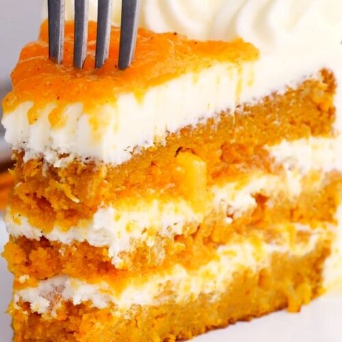 Ultimate Carrot Cake slice on plate with fork