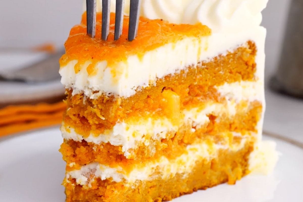 Ultimate Carrot Cake slice on plate with fork