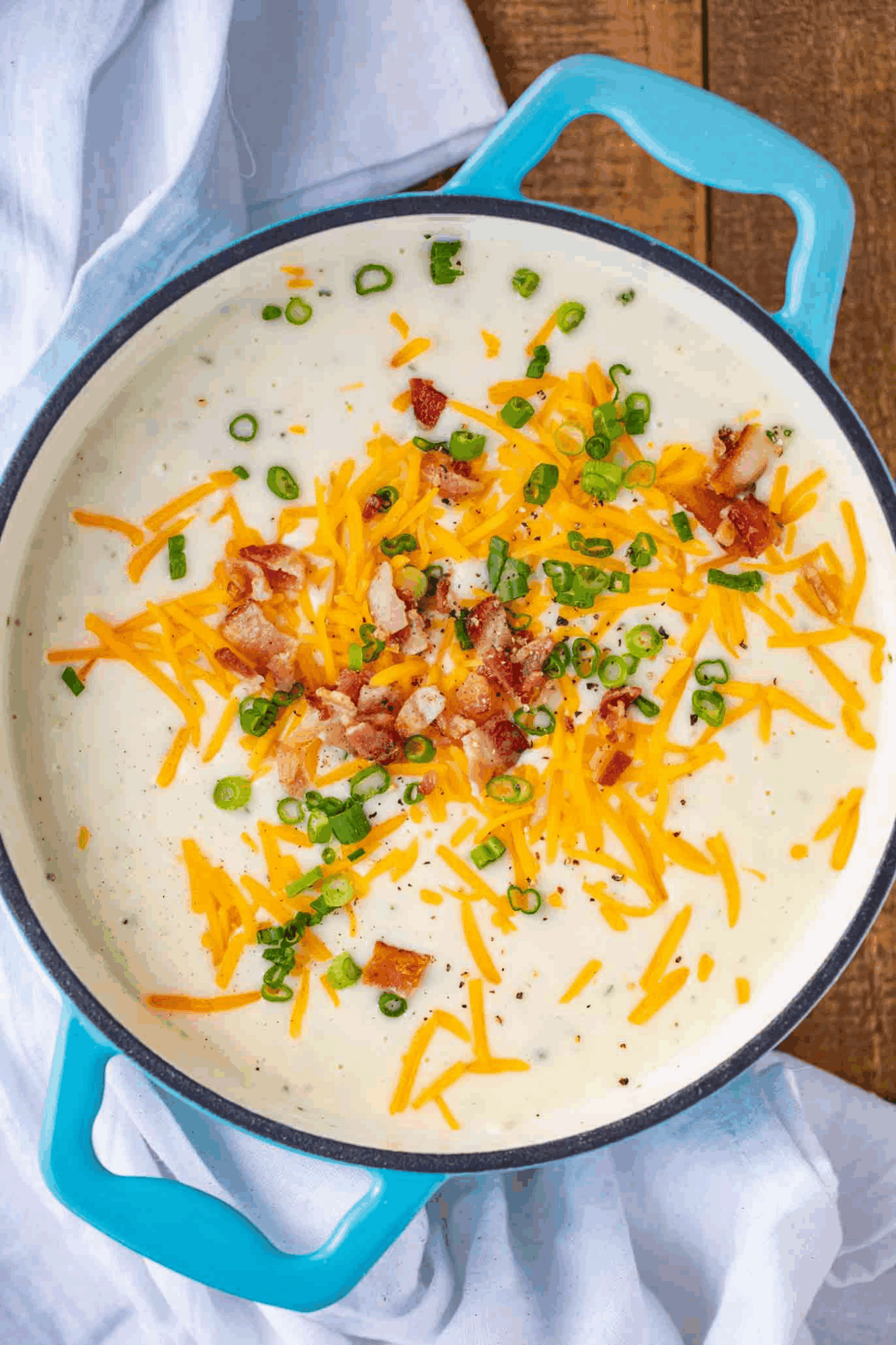 Finished soup with cheese and bacon garnish