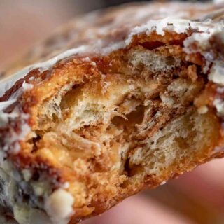 Bite of pastry with apple and cinnamon
