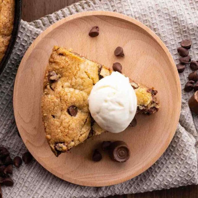 Chocolate Caramel Cookie Pizza slice on plate with ice cream