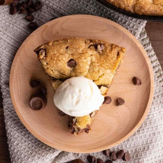 Chocolate Caramel Cookie Pizza slice on plate with ice cream
