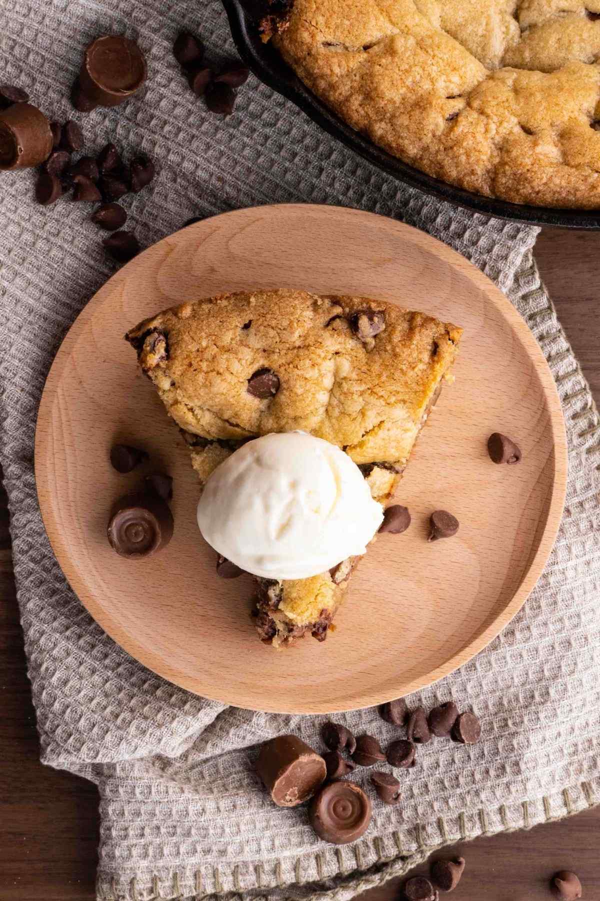 Chocolate Caramel Cookie Pizza slice on plate with ice cream