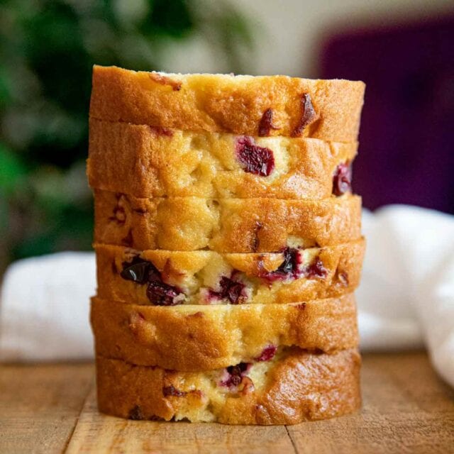 Cranberry Bread stacked on wooden table