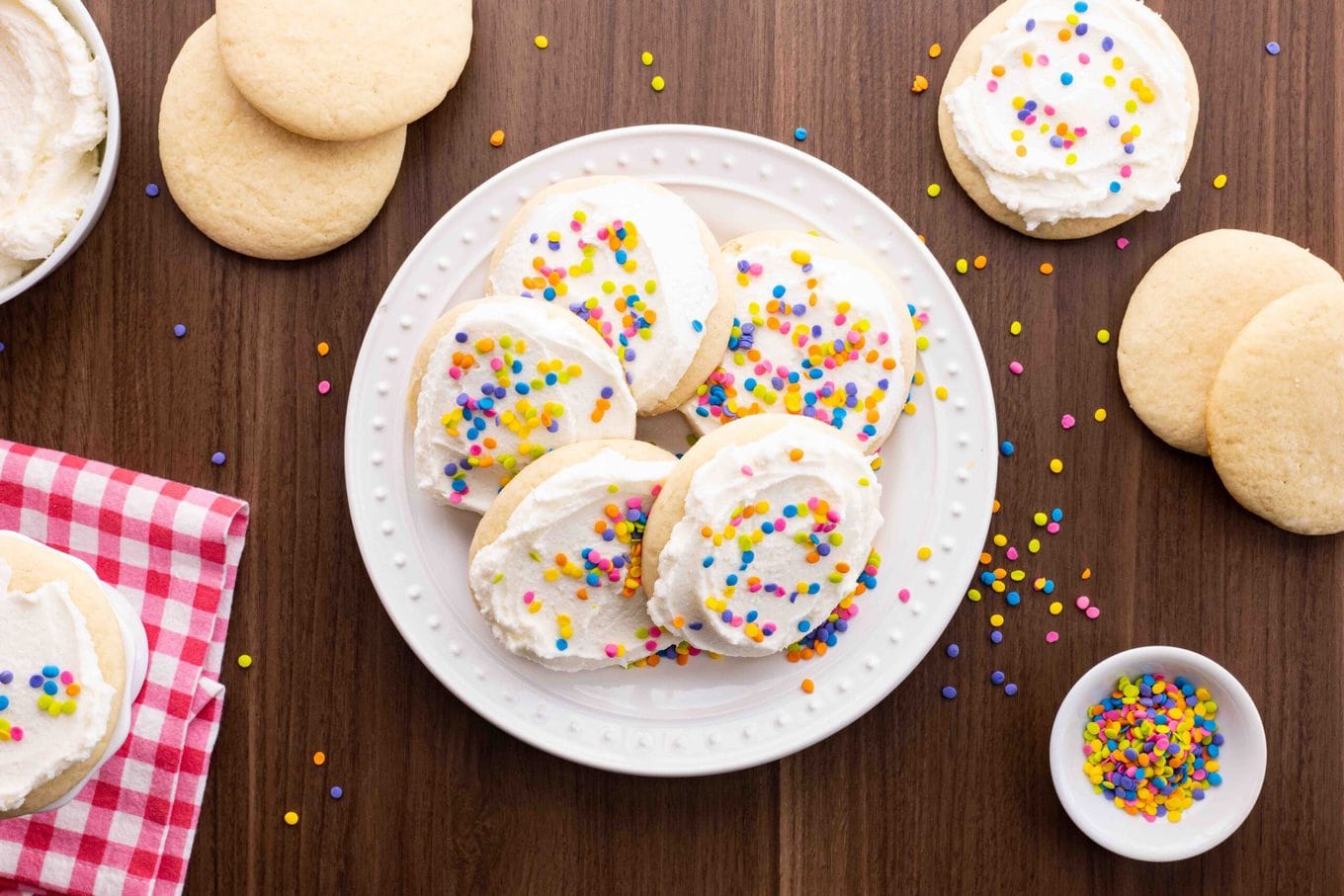 Lofthouse Sugar Cookies with white frosting and colorful sprinkles on plate