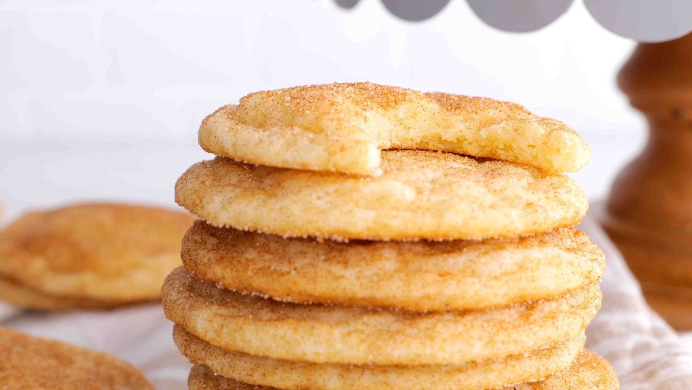 Snickerdoodle Cookies stacked with bite taken