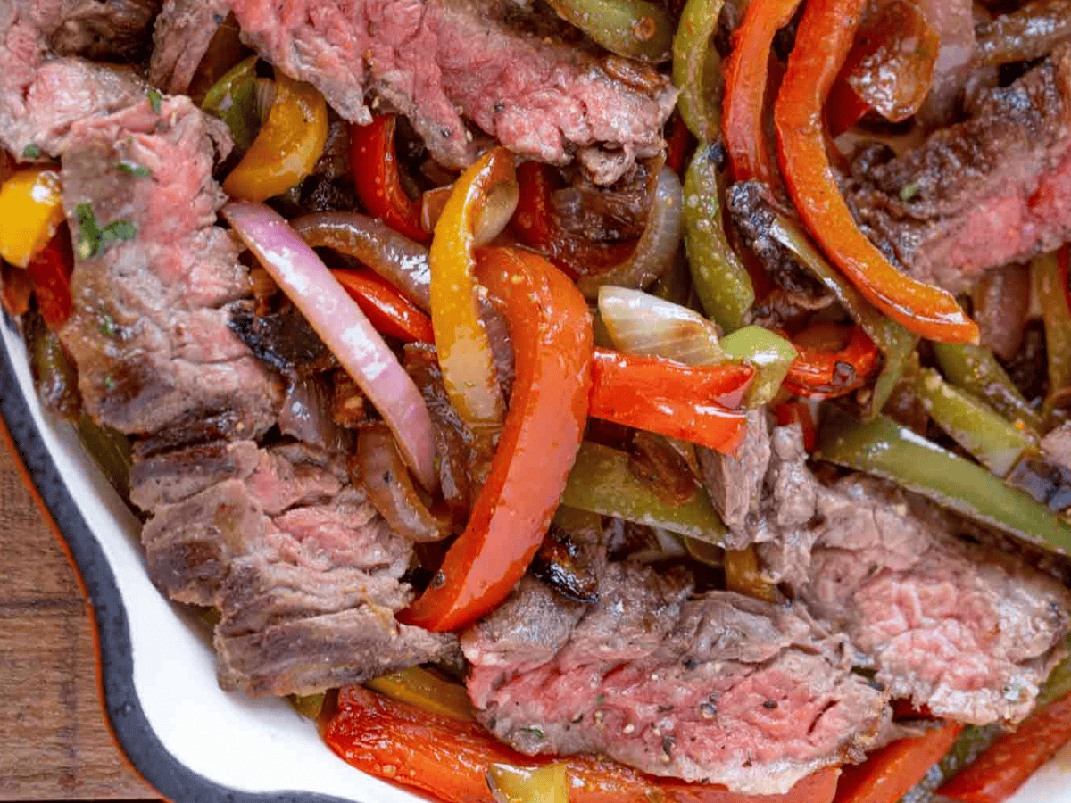 close up steak veggie in skillet
