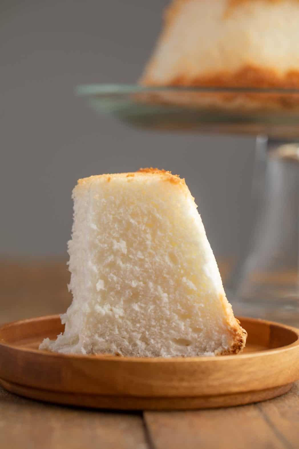 Slice of Angel Cake on a wooden plate