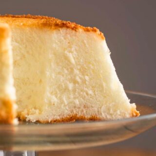Side view of cake on stand with slices removed