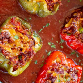 Bell peppers stuffed with beef in a red sauce