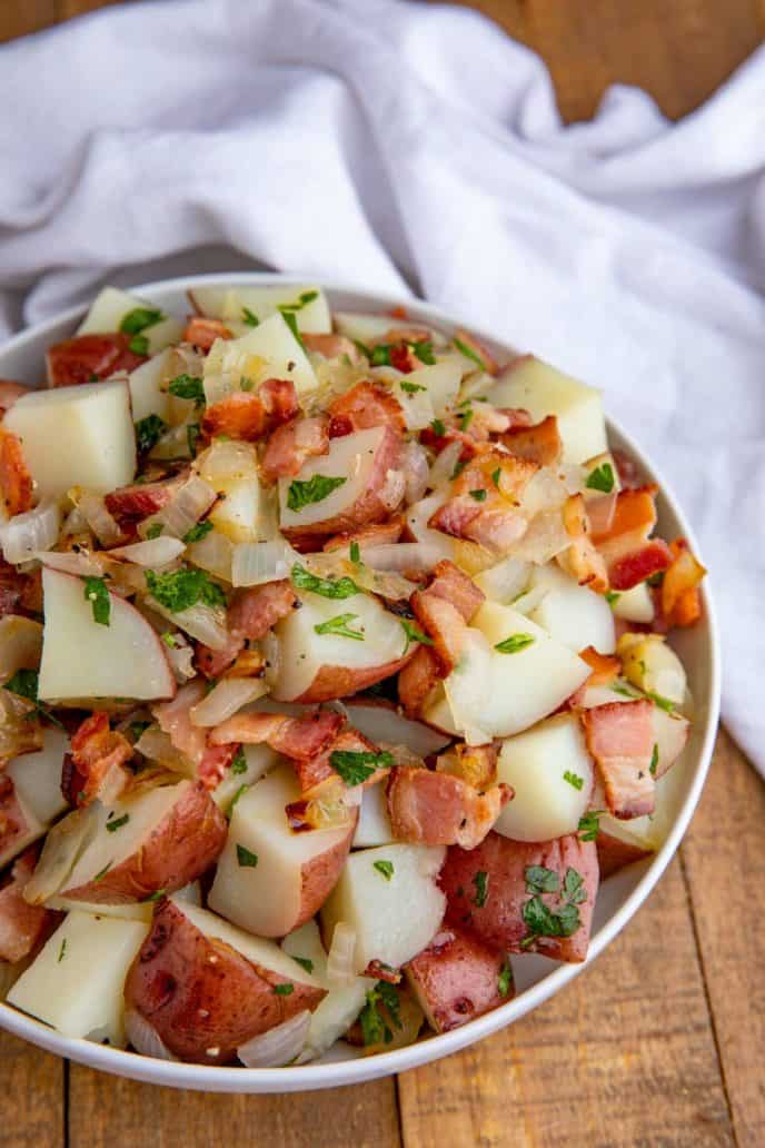 Potato Salad with Bacon and Onions from Germany in white bowl