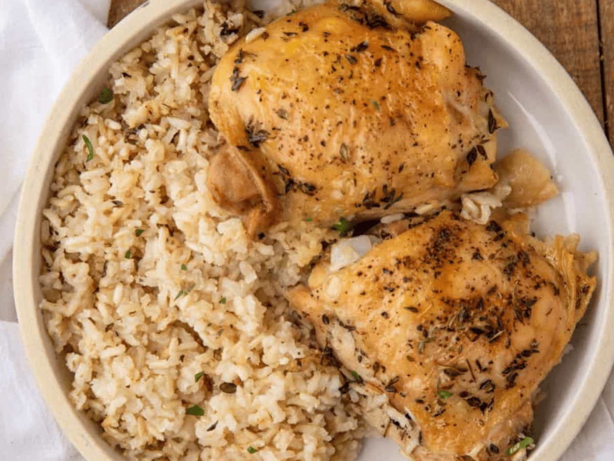 Chicken with rice served on plate