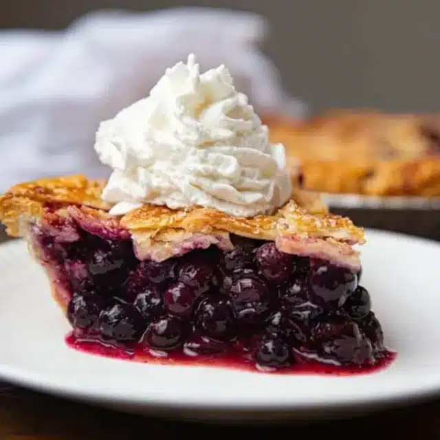 Pie served on plate with whipped topping
