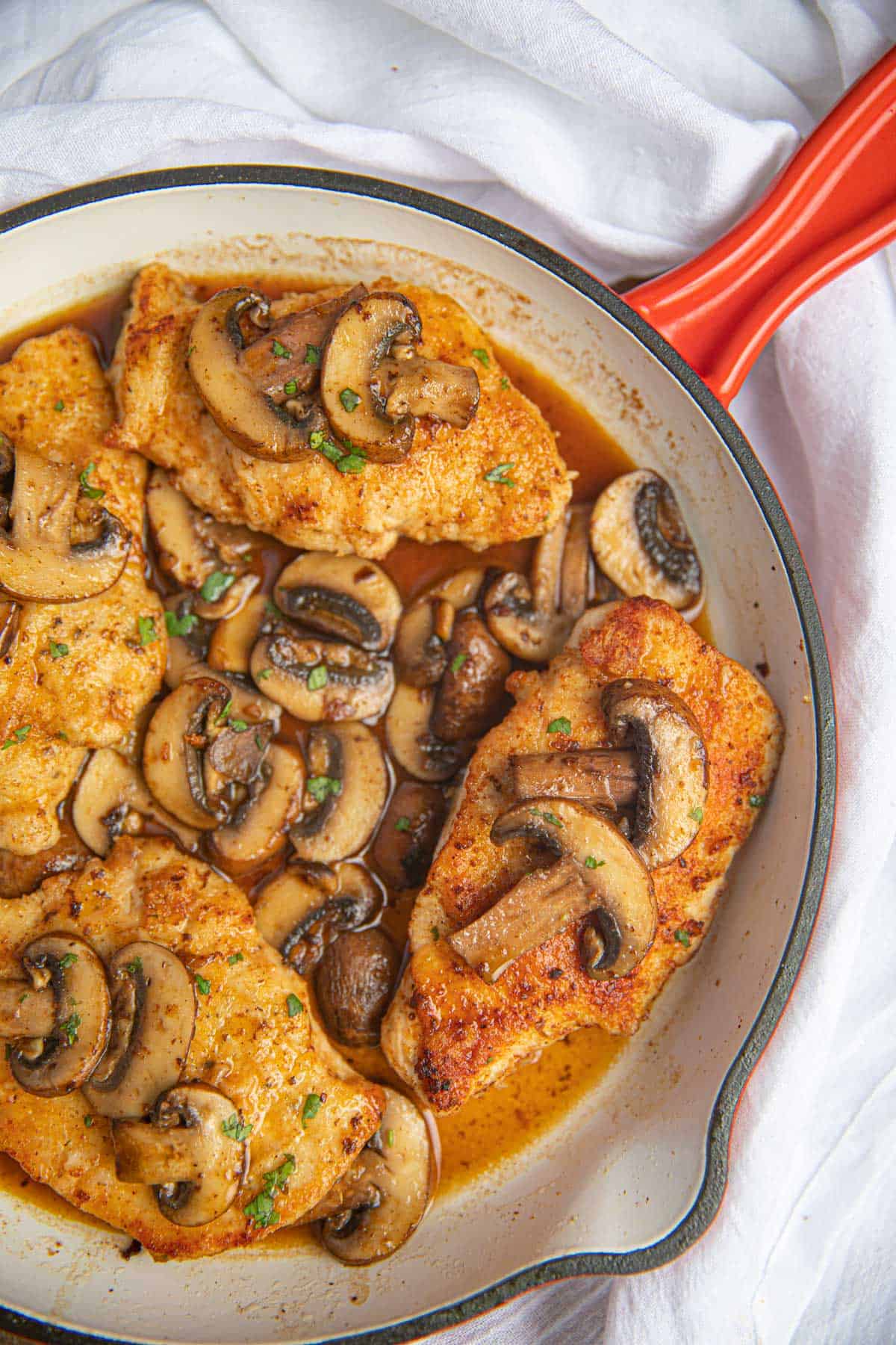 Easy Italian Chicken Marsala in red frying pan