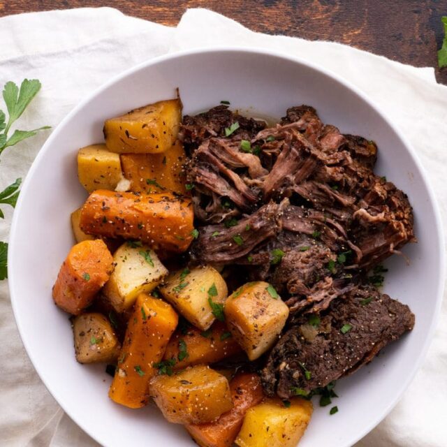 Classic Pot Roast in bowl with carrots and potatoes