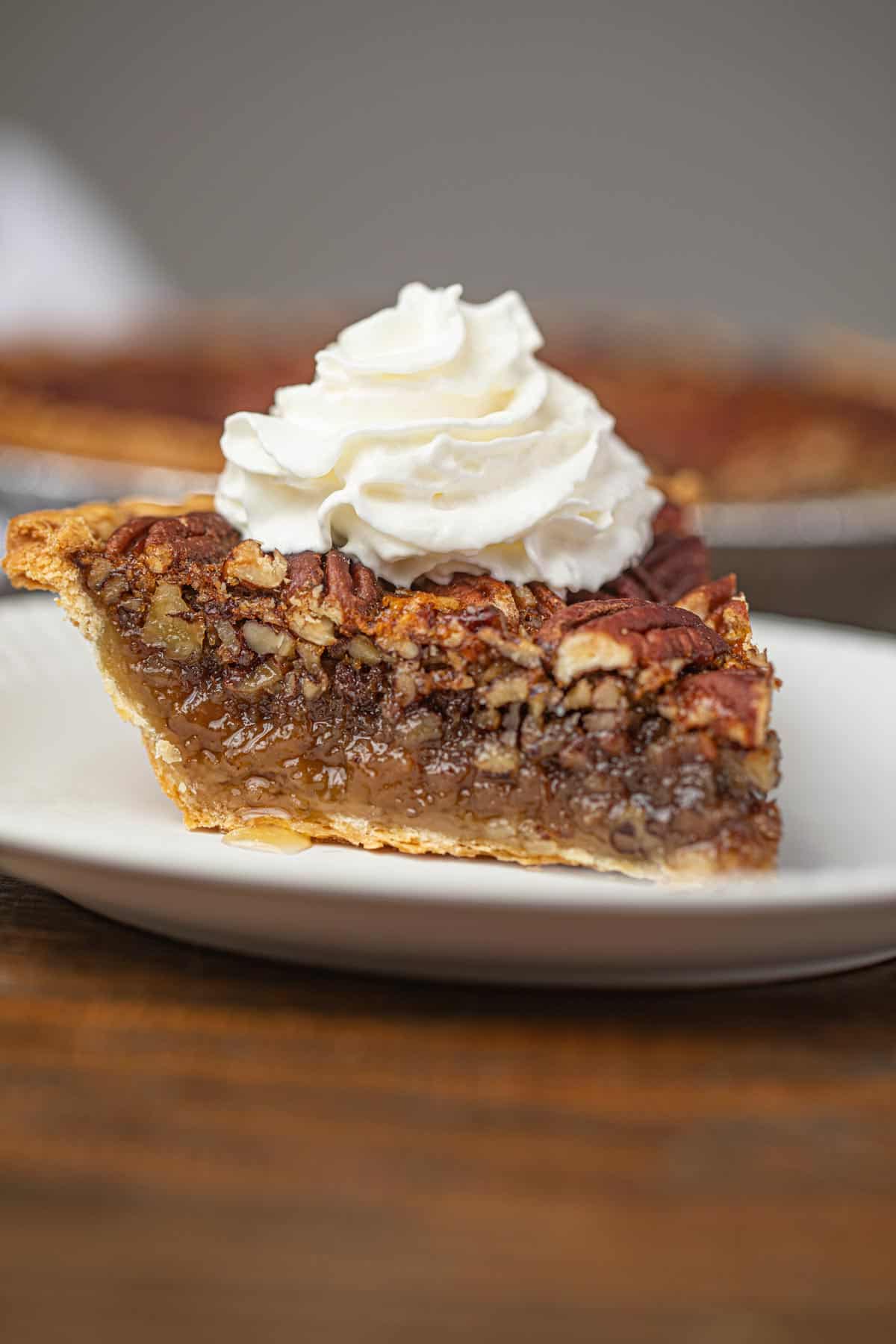 Pecan Pie with Whipped Cream on Plate