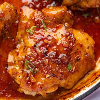saucy chicken portions in skillet