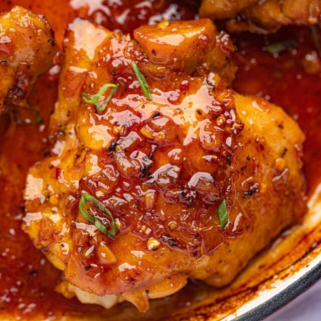 saucy chicken portions in skillet