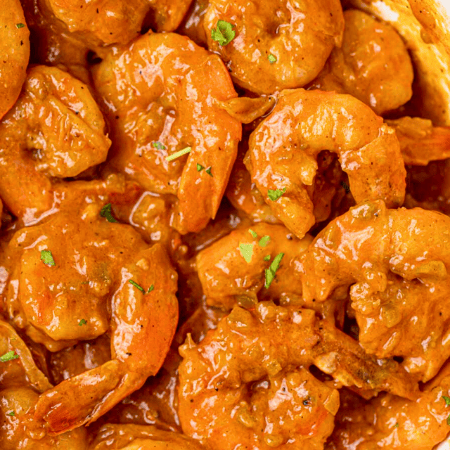 Cooked shrimp in sauce in skillet