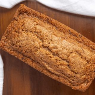 Baked loaf of bread on cutting board