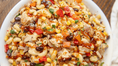 Bowl of pasta salad with BBQ chicken and veggies