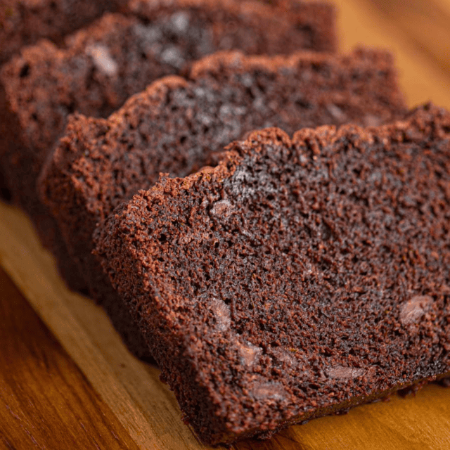 brown bread slices leaned against one another on a cutting board