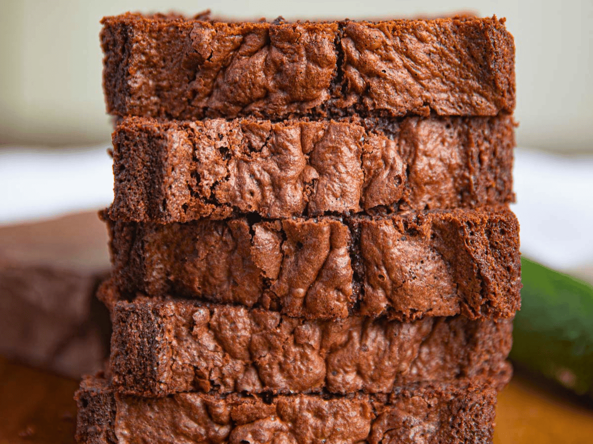 brown sweet bread stacked on one another on a cutting board