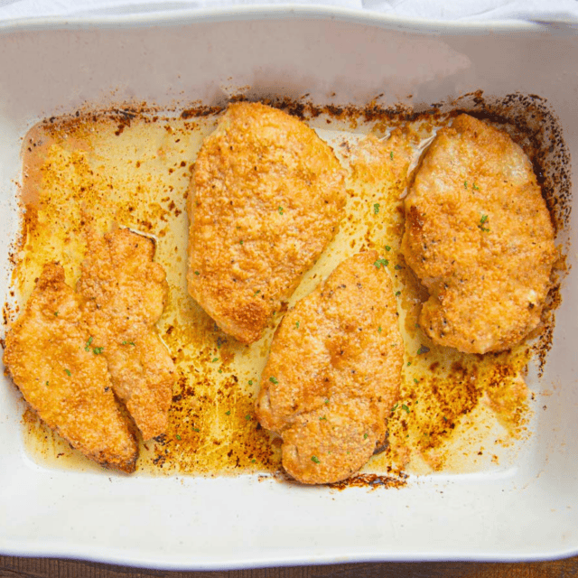baked chicken in a white baking dish