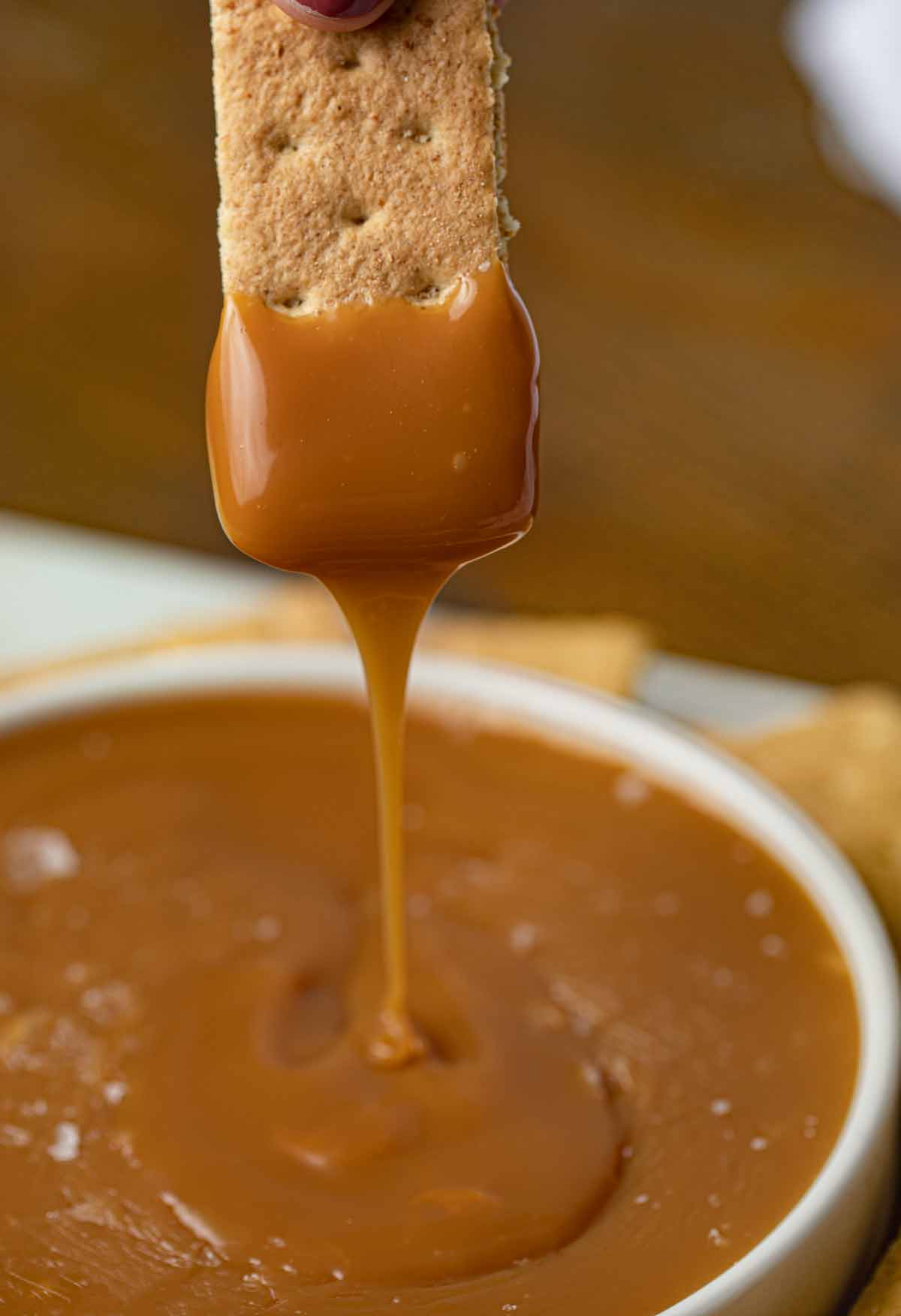 Graham Cracker dipped in Caramel Fondue