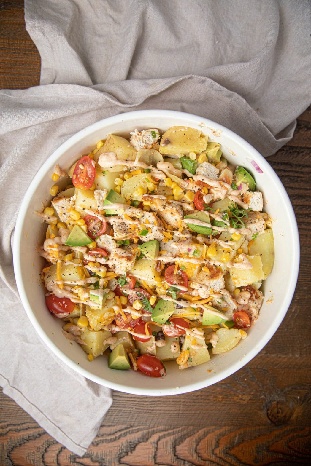 Bowl of potato salad with dressing shot from above
