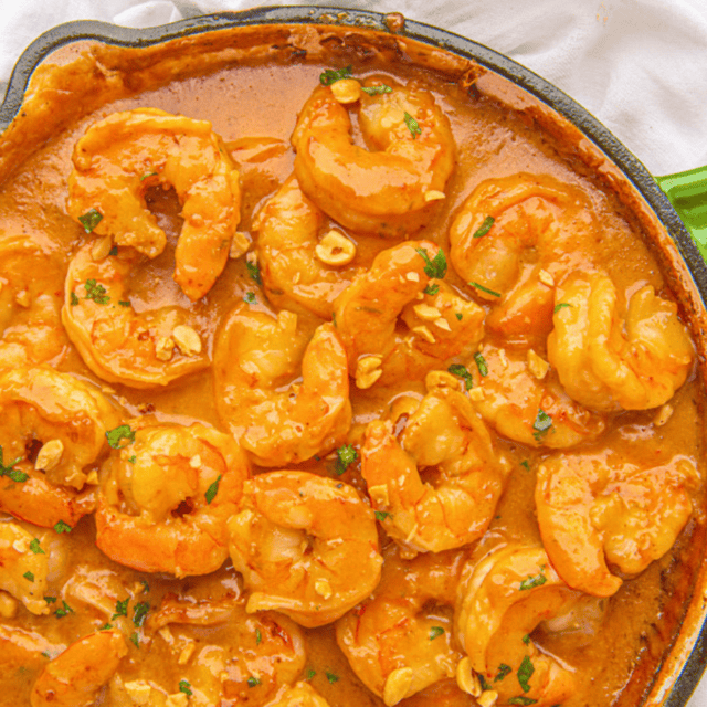 pan of shrimp cooked in Thai peanut sauce