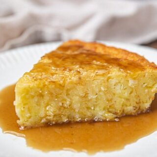 A slice of Coconut Pie with Rum Sauce