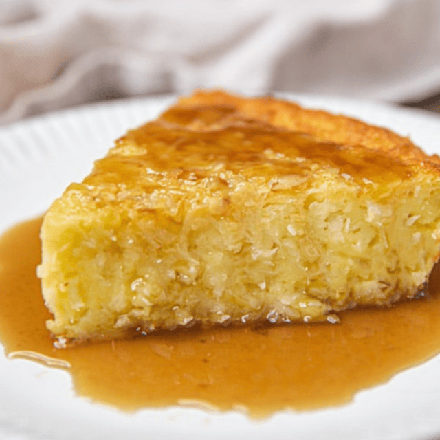 slice of pie on plate with sauce