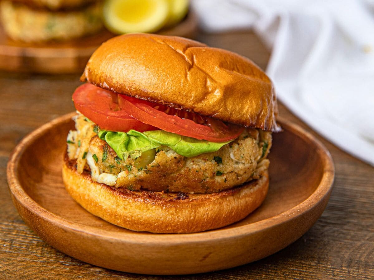 Crab patty on brioche bun with lettuce and tomato