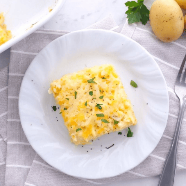 hash brown on a white plate with a fork