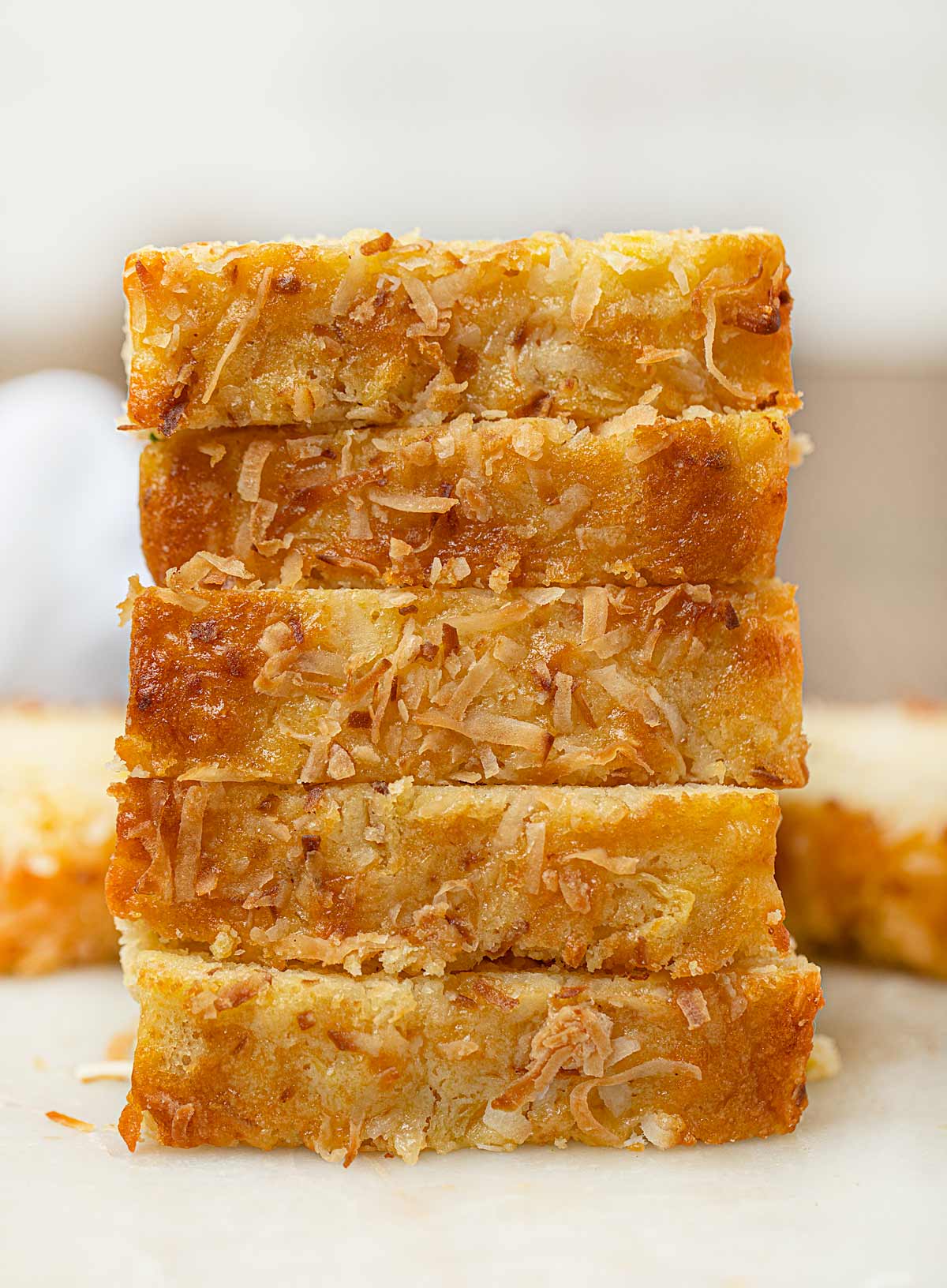 Pineapple Coconut Bread stacked on cutting board