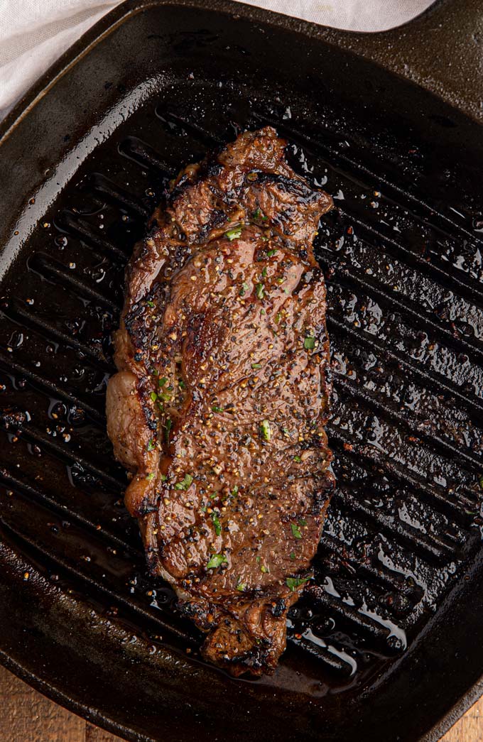 Steak Marinade on Grilled Ribeye in Cast Iron Pan