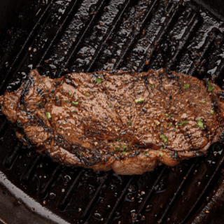 Cooked meat on cast iron pan