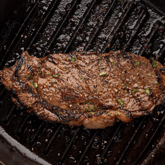 Cooked meat on cast iron pan